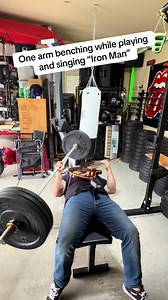 One-arm bench press while playing Bass — Iron Man workout