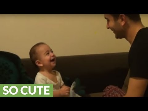 Baby laugh hysterically at dad's funny antics