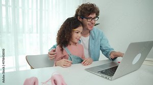 Father explain generate AI while american girl looking at screen. Attractive caucasian dad teaching daughter learning coding engineering prompt and programing system at table with headphone. Pedagogy.