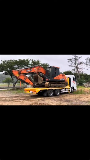 Loading an Excavator onto a Flatbed Truck