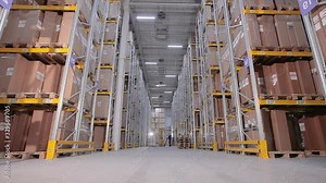 Large warehouse workflow, warehouse equipment at work, workers in a large warehouse