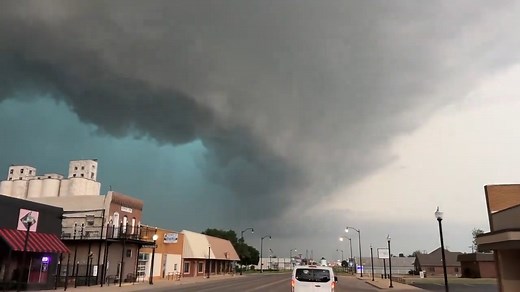 A massive, green monster supercell approaches as tornado sirens sound in Hennessey, Oklahoma on our chase this past Monday. Video: Matt Phelps. | Tempest Tours