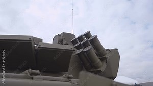 Dynamic protection and other military equipment on the turret and board of the Russian tank