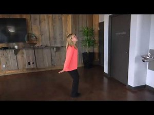 Dianne demonstrating the Hummingbird pose