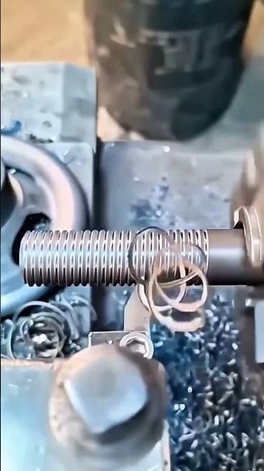 A lathe machine being used to create internal threads in a workpiece