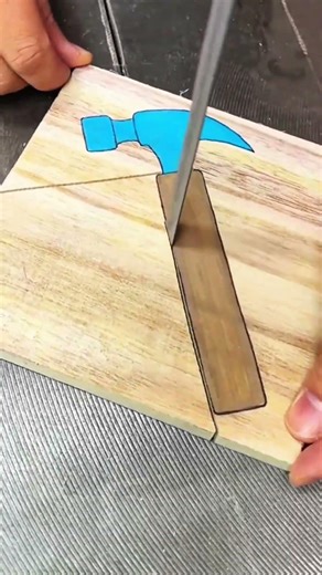 Coping saw tracing hammer outline on wood