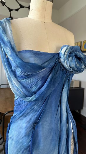 Lela on Instagram: "Something blue inspired by a happy accident while hydrating. #smartwaterpartner While I typically make wedding looks, I figured every bride needs their something blue. This gown was created with white silk chiffon dyed with indigo and then painted with fabric paint blended with @smartwater to achieve a watercolor painterly look. What do you think? 💙 #bridaldesigner #fashiondesigner #somethingblue"