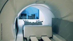MRI machine with a moving table shown from the inside