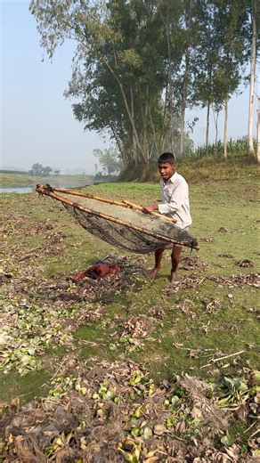 Village Kid Using Traditional Push Net