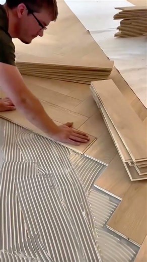 Installing Wooden Floors Manually Using Herringbone Patterns for Interior Design Ideas