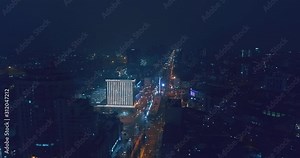 Top down aerial view of night streets in downtown Kyiv, Ukraine, with bright night lighting. Wide shot on dji mavic 2 pro hasselblad camera with smooth cinematic drone motion