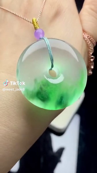 Jade Necklace is a graceful expression of elegance and cultural heritage. Featuring a finely crafted jade pendant, this necklace captures the natural beauty of jade, with its soft green hues and smooth, polished surface. The pendant is carefully carved into a classic round or teardrop shape, symbolizing unity and eternity in Chinese culture. The jade pendant is suspended from a delicate chain, complementing the rich color of the stone. The simplicity of the design allows the beauty of the jade t