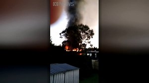 "Look at the smoke, bloody hell". Video of a fatal house fire in Everton Hills this morning shows just how intense the blaze was. Video: Douglas Maior | ABC Brisbane
