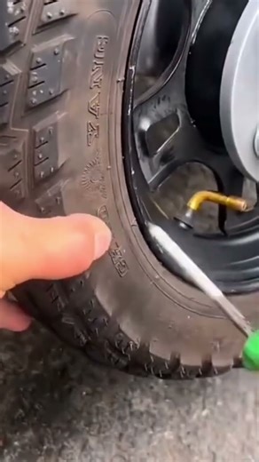 The process of patching a car tire using special tools that have been provided
