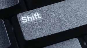 Shift Key on Desktop Keyboard Pressed by Finger Hand Multiple Times - Close Up Macro Shot