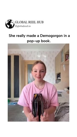 GLOBAL REEL HUB™ on Instagram: "The post features a viral video of a young woman demonstrating a intricate pop-up book where a Demogorgon from Stranger Things emerges dramatically upon opening, garnering over 2 million views and 41,000 likes for its impressive craftsmanship. Contrary to the caption claiming "she really made" it, the book is actually engineered and illustrated by paper artist Simon Arizpe as part of a Stranger Things pop-up series, with the woman simply showcasing the pre-made pr