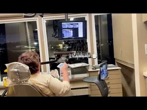 Dental Robot collecting payments from patients