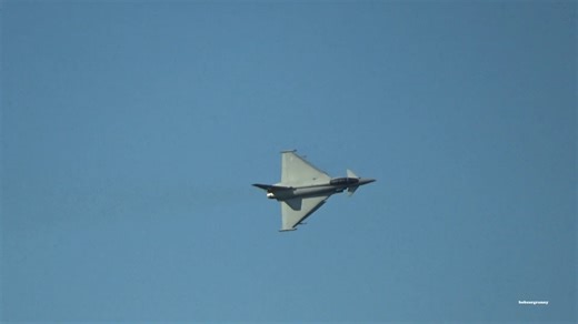 RAF Typhoon jet roars over a live cricket match