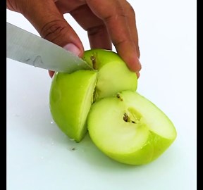 Cutting A Green Apple Perfectly Vertical