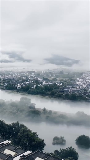 11K views · 201 reactions | This breathtaking drone shot from Jingxian county, #Anhui Province, shows an ethereal landscape as mist wraps around iconic Huizhou-style dwellings while a small boat gently navigates the mirror-like water. #TravelinChina #SplendidChina | Xi's Moments | Facebook