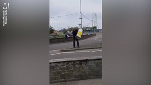 Man argues with bollard