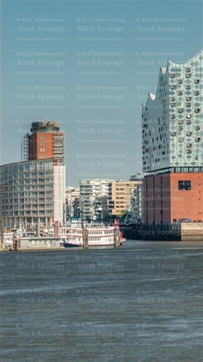 Timelapse of Hamburg's iconic Elbphilharmonie concert hall, with ships and boats in the foreground