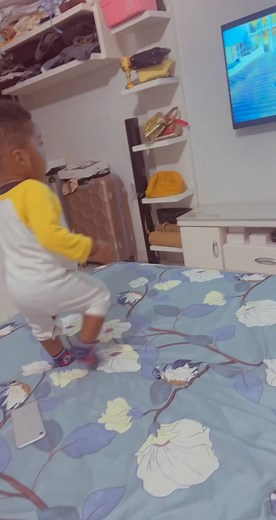 Playful Toddler Dance in Colorful Bedroom