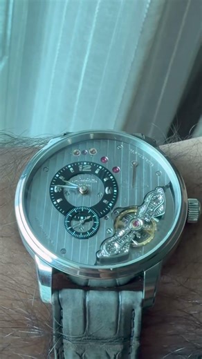 Some watches tell time. This one makes you stop time just to stare at it.