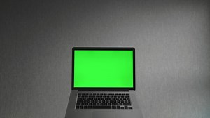 Laptop computer with a green screen - Free Stock Video