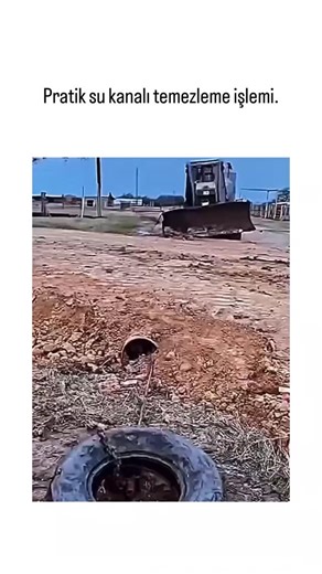 👁️ on Instagram: "The post demonstrates a resourceful DIY technique for unclogging rural drainage channels by threading a chain through an old tire placed over the grate, then using a bulldozer to pull out mud and debris, restoring water flow in under 30 seconds. Posted by @TamirveTadilat , a Turkish account specializing in repair hacks, this video highlights low-cost maintenance for infrastructure in areas with limited access to professional tools, garnering 52K views and 86 likes for its simp