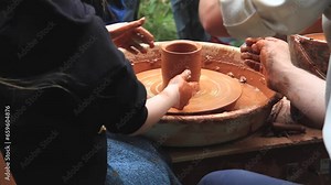 Pottery training. Making a clay pot on a potter's wheel. Manufacturing process.