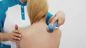 Young woman receiving electromagnetic therapy in a modern clinic. The treatment speeds up tissue healing, eases pain, and promotes muscle recovery, contributing to overall wellness. Stock Video
