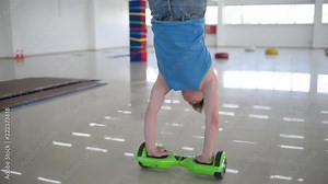 Man acrobat balancing motorized scooter - shows tricks