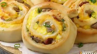 Cheesy Sausage Breakfast Pinwheels are like unrolling a little piece of heaven loaded with smoky bacon, pork sausage, scrambled eggs and ooey gooey cheese! http://www.theslowroasteditalian.com/2017/07/cheesy-sausage-breakfast-pinwheels-recipe.html