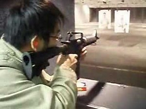 my friend's first time shooting a colt m4 9mm m635 in full auto