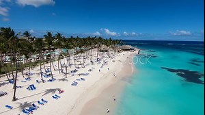 Beautiful beaches of the world. Top view of Bora Bora beach. White sand, blue sea\Bora Bora, view of the beach from the ocean. Hotel on the beach. best beaches in the world. palm trees. Turquoise sea