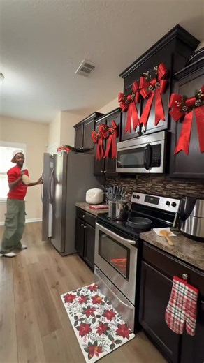 HolidayandCo on Instagram: "AJ said he was “helping” @dlias1205 in the kitchen… then hit her in the head with the bread 😭😭 What does he need to get her for Christmas after THIS!? And yes — they’re rocking their Holiday & Co. fits from our shop 🛍️🎅🏾🎄✨"