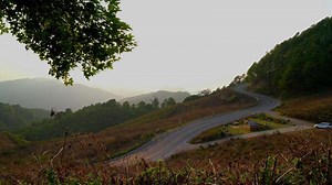 Download sunset with mountain layer and road for free