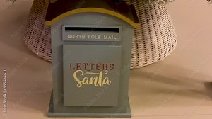 Closeup gray post box for letters to Lapland to Santa Claus. Christmas tradition. Decorative mailbox Santa Claus workshop, wrapped gifts presents boxes on holiday eve in night on xmas background