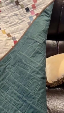 Modern Style homemade quilt with geometric longarm pattern.