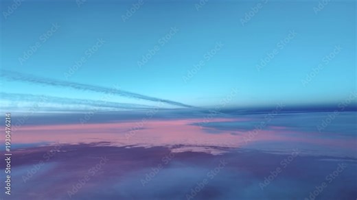 Contrails at sunrise with a purple horizon captured from a jet cockpit flying bellow between layers of ethereal clouds.