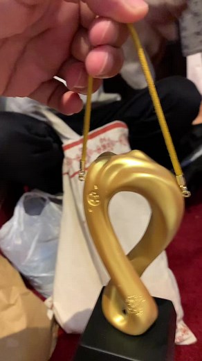 Examining a Unique Twisted Design Golden Trophy