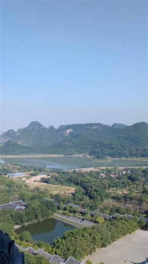 Stepping out from the 12th floor of the Bao Thien Stupa at the Bai Dinh Pagoda in Ninh Binh, Vietnam. Great views of the pagoda complex and Ninh Binh. One of the best things to do in Ninh Binh. #visitninhbinh #ninhbinh #ninhbinhtravel #ninhbinhtrip #vietnamtravel #vietnamtrip | Anthony in Vietnam