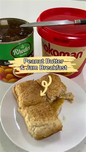 Enjoying Peanut Butter and Jam Sandwich for Breakfast