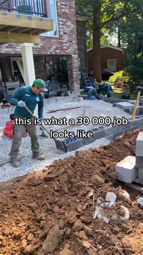 Transforming Outdoor Spaces: Flagstone Patio Design and Retaining Wall Installation