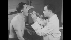 clip-1059739901-circa-1940s---workers-receive-medical-checkups