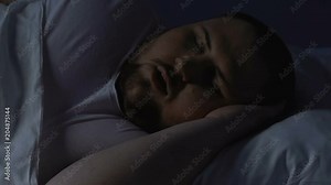 Chubby male snoring at night in bed, sleeping apnea caused by excess body weight