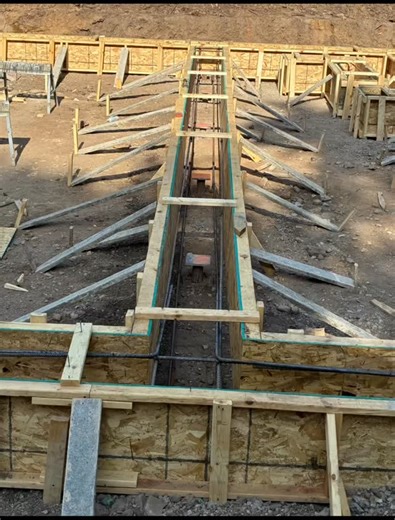 Where it all started. 54 helical piers embedded into 24” tall footings also known as grade beams. 60 yards of concrete just into the footings. Waterproofed the footings, because why not? ICF poured walls the following week. #building #construction | Zurbey Builds