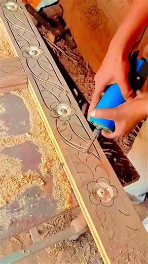 carving beautiful floral patterns on wood surface using a electric machine with great precision