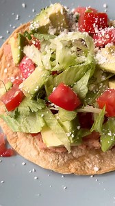 It’s the perfect quick and easy dinner. How to Make Tostadas Ingredients For the tostadas: - Corn oil or extra virgin olive oil - corn tortillas - Salt For the toppings: - 3 1/2 cups refried beans, homemade or from 2 (15-ounce) cans - 1/2 head iceberg lettuce, sliced thin and seasoned with salt and vinegar (no oil) - 2 medium tomatoes, chopped - 1 to 2 avocados, chopped peeled and pitted, or guacamole - 8 ounces grated Monterrey Jack, Cheddar, or crumbled queso fresco and/or cotija cheese - 1 cu